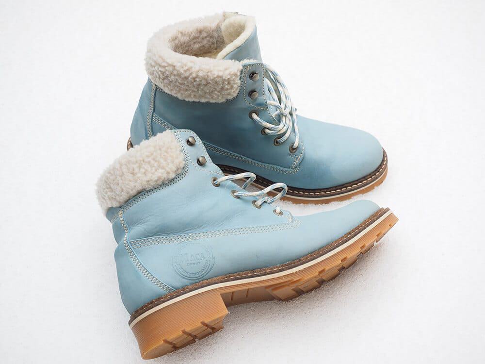 A pair of baby blue winter boots