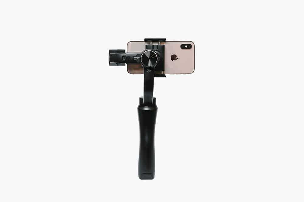 A gimbal stabilizer holding an iPhone