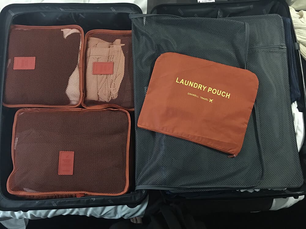 Compression packing cubes in an open luggage