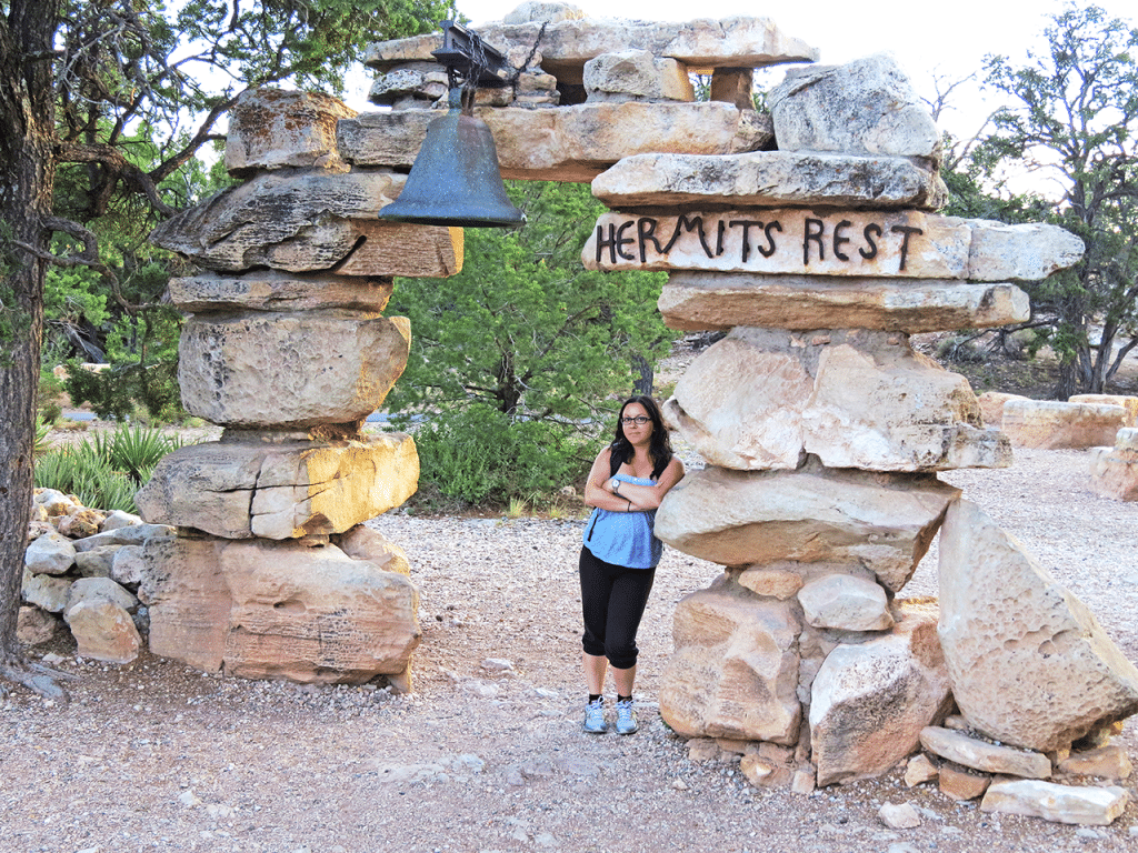 Dany posing under a rock arch at Hermit's Rest in the Grand Canyon National Park