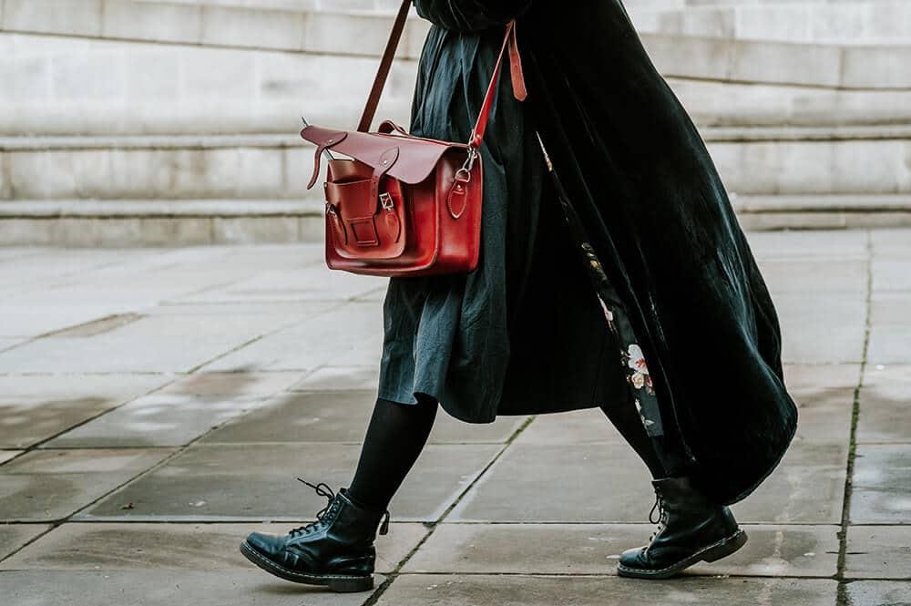 Woman dressed in black with thermal leggings 