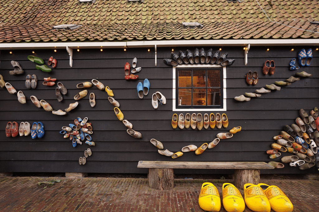 Dutch clogs on a wall in an artsy exhibition near Amsterdam