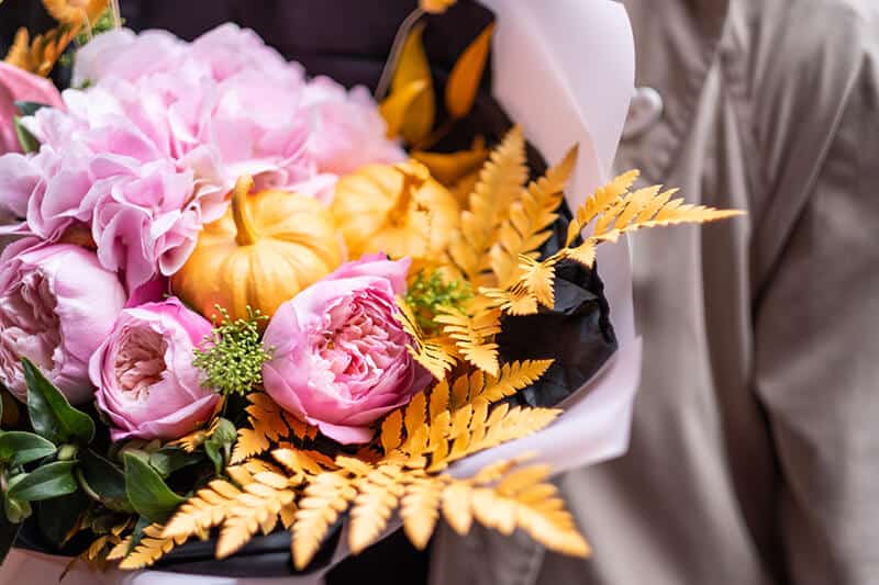 A bouquet of pink spring flowers and tulips