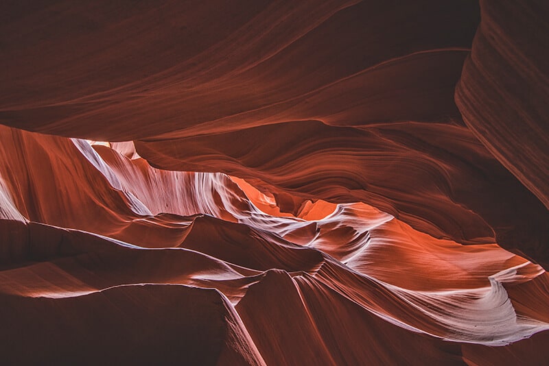 Orange rocks seen from below at the bottom of Upper Antelope Canyon