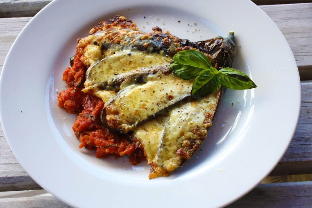 Eggplants with basil, tomatoes and mozzarella cheese
