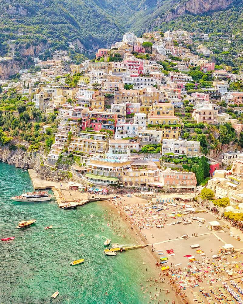 View of Positano and some boats on a stretch of sea seen from above