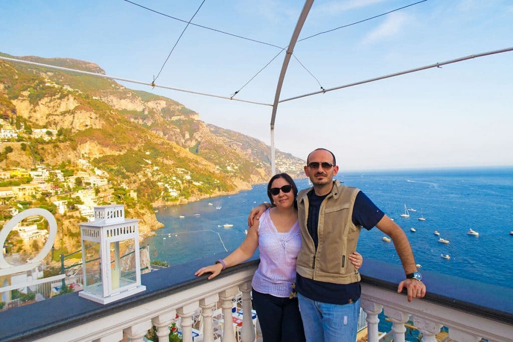Dany and Aldo in Positano overlooking the Amalfi Coast cliffs