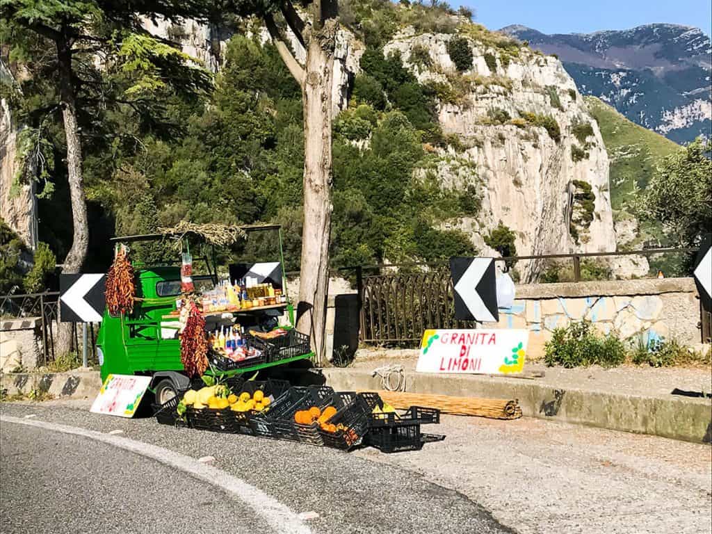 Small ape car selling Italian lemon granita on the road on the Amalfi Coast
