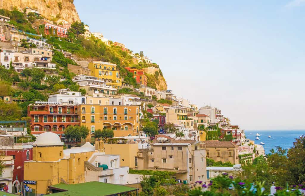 View of Positano colorful houses at sunset