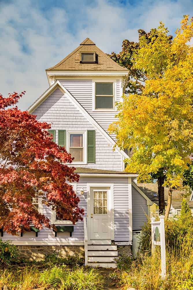 Traditional house in the Adirondacks with leafing trees