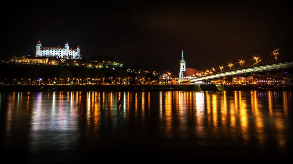 Bratislava in winter at night  seen from the river