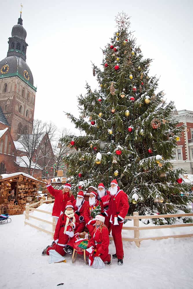 A group of Santas in a snowy Riga