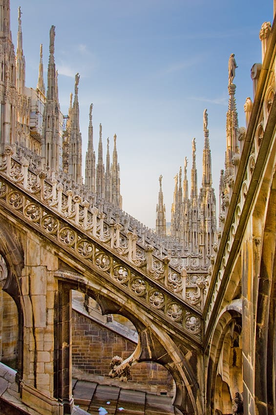 View of the gothic stone spiers on the Duomo Terrace in Milan (Italy)