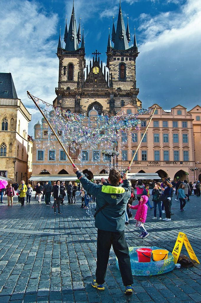 best places to stay in Prague - street artist in Republic Square