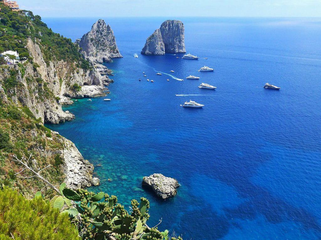 View of the Faraglioni rocks from the cliffs in Capri (Italy)