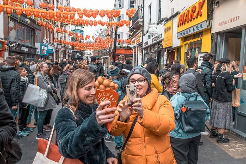 Dany and a friend shooting at Chinatown while eating bubble wraps