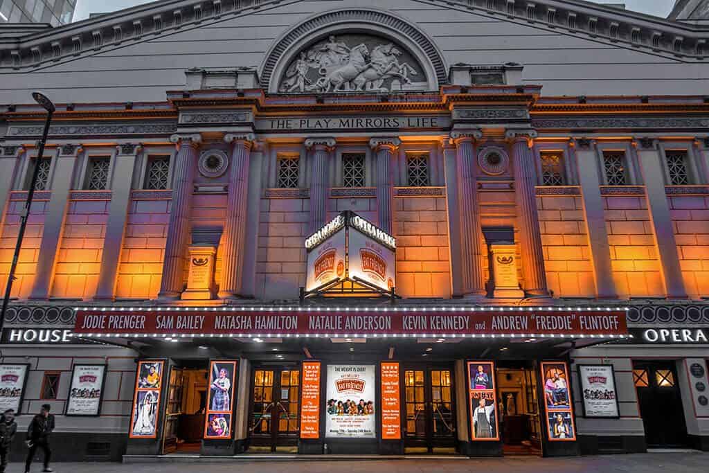 The Manchester Opera House at night, all lit up