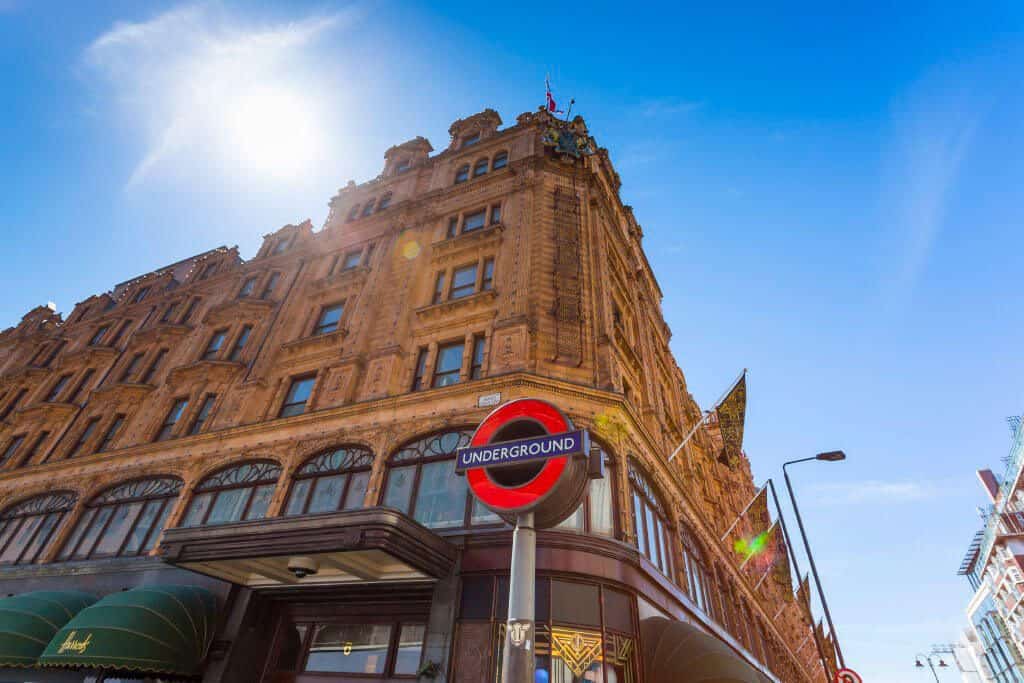 Harrods mall in London with the iconic underground sign at its corner