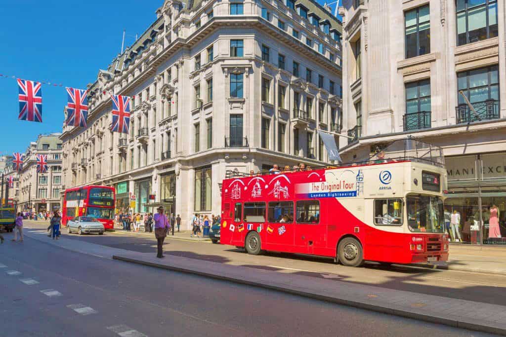 Regent street with a red bus, one of the places to photograph in London