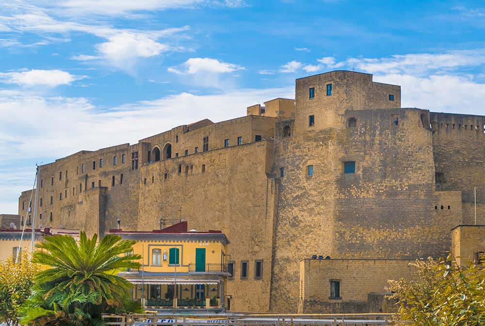 Best things to do in Naples Italy | A view of Castel dell'Ovo on the island Megaris near Naples