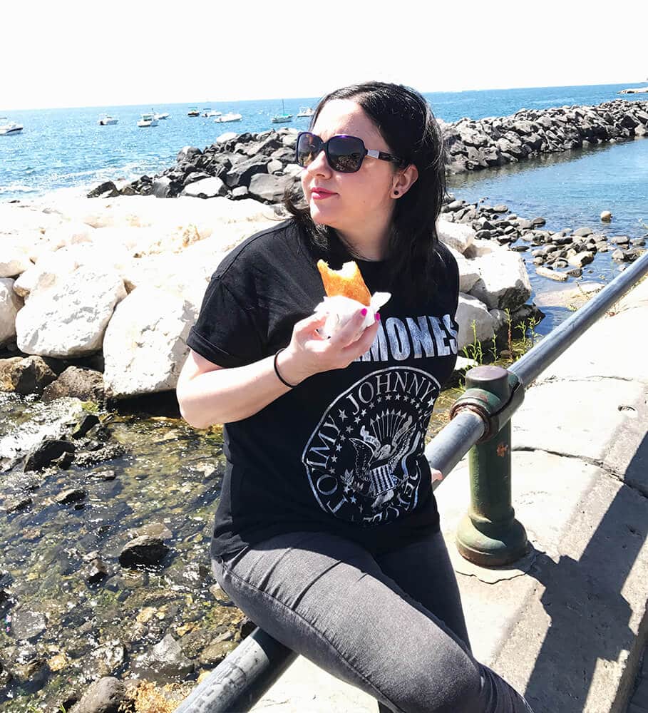 Best things to do in Naples Italy | Dany eating babà on Lungomare Caracciolo in Naples