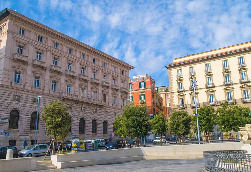 Best things to do in Naples Italy | Piazza Municipio in Naples nestled between Palazzo San Giacomo and the Fontana del Nettuno