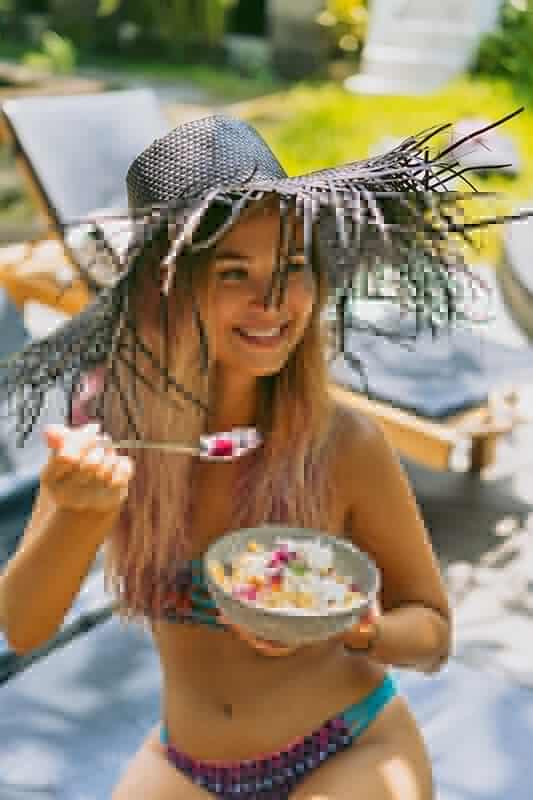 Girl eating a veggie bowl
