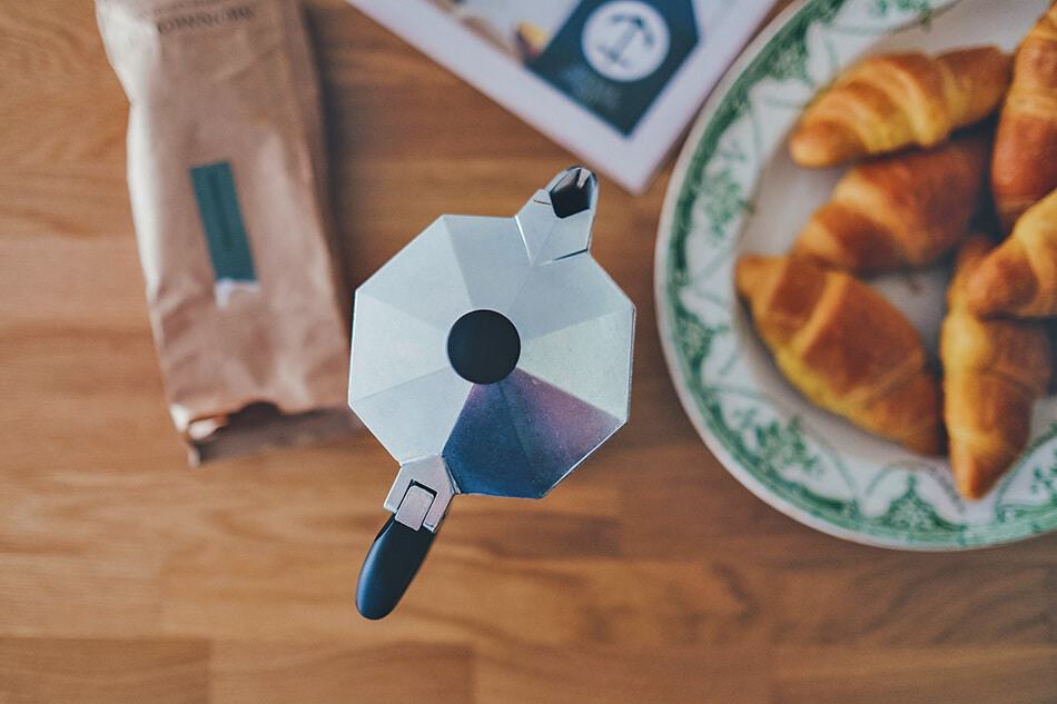 Naples Cafe - Traditional Italian breakfast: small croissaints, newspaper and a moka pot