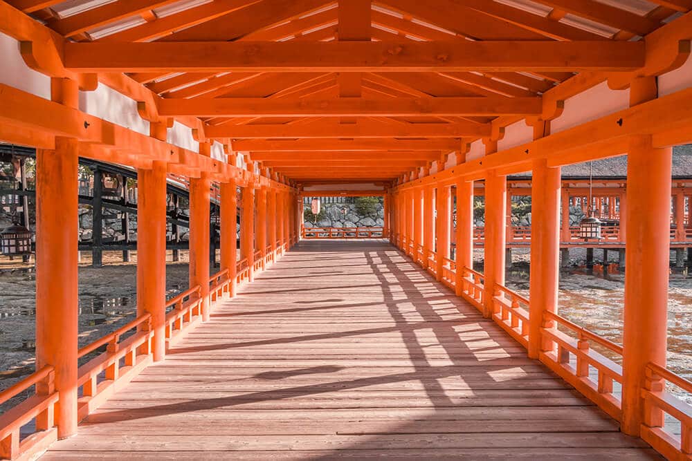 Things to do in Miyajima | Internal corridor at Itsukushima shrine at sunset
