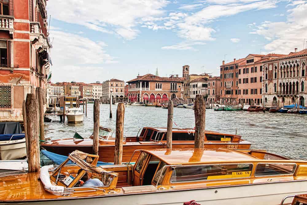 Wooden boats in one of the main canals in Venice (Italy)