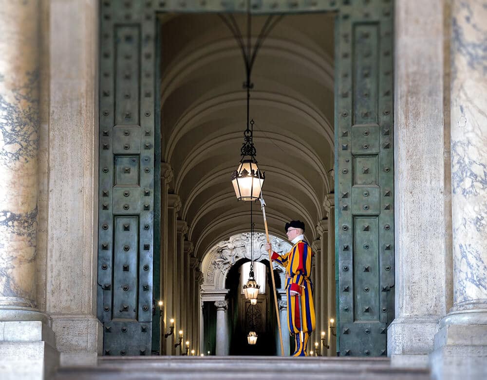 Swiss guard watching over one of the Papal buildings in Vatican City