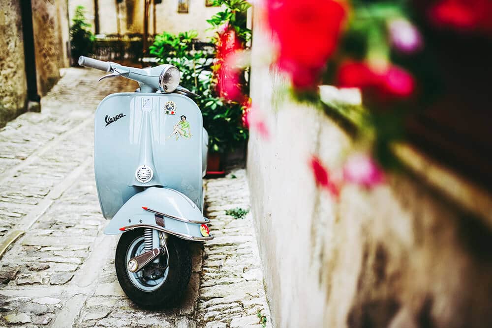 An Italian Vespa parked in Trastevere, a cute district in Rome