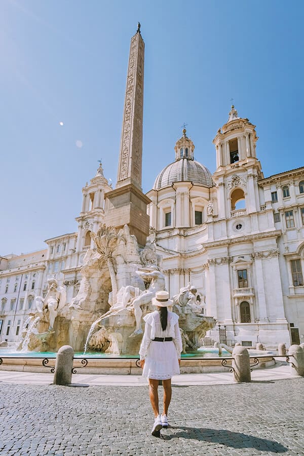 Girl walking in Piazza Navona (Rome, Italy)