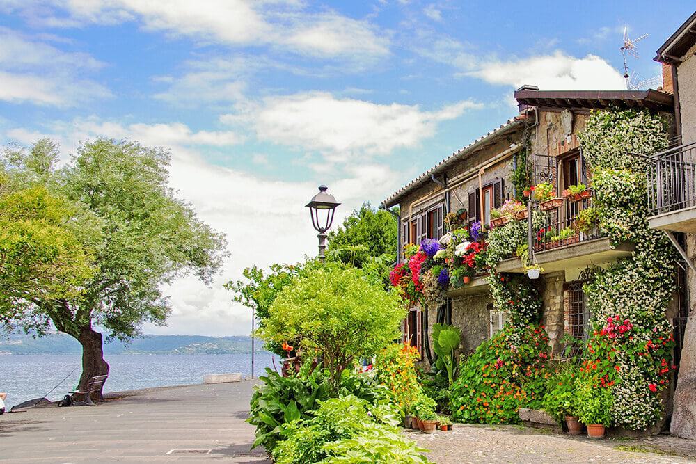 Beautiful coastal house surrounded by flowers in Anguillara near Rome (Italy)