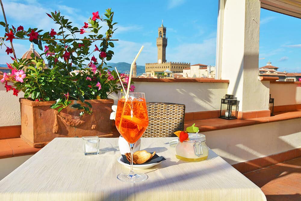 Italian aperitivo in Florence with Palazzo Vecchio in the background