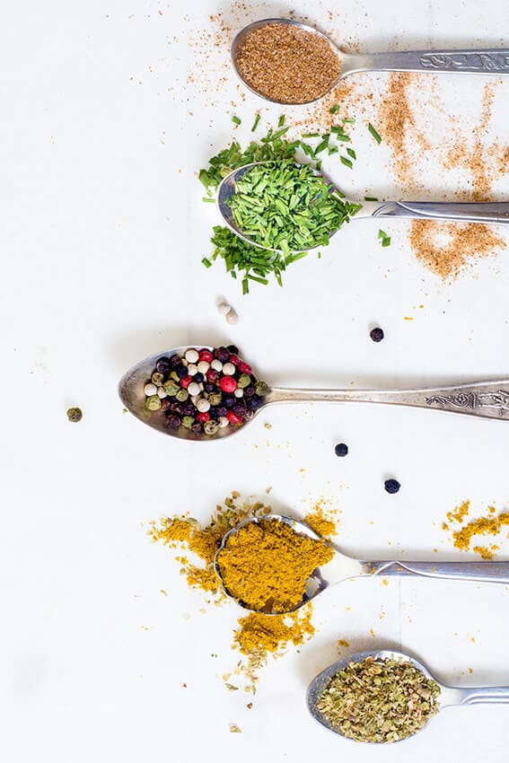 Spoons with spices from all over the world