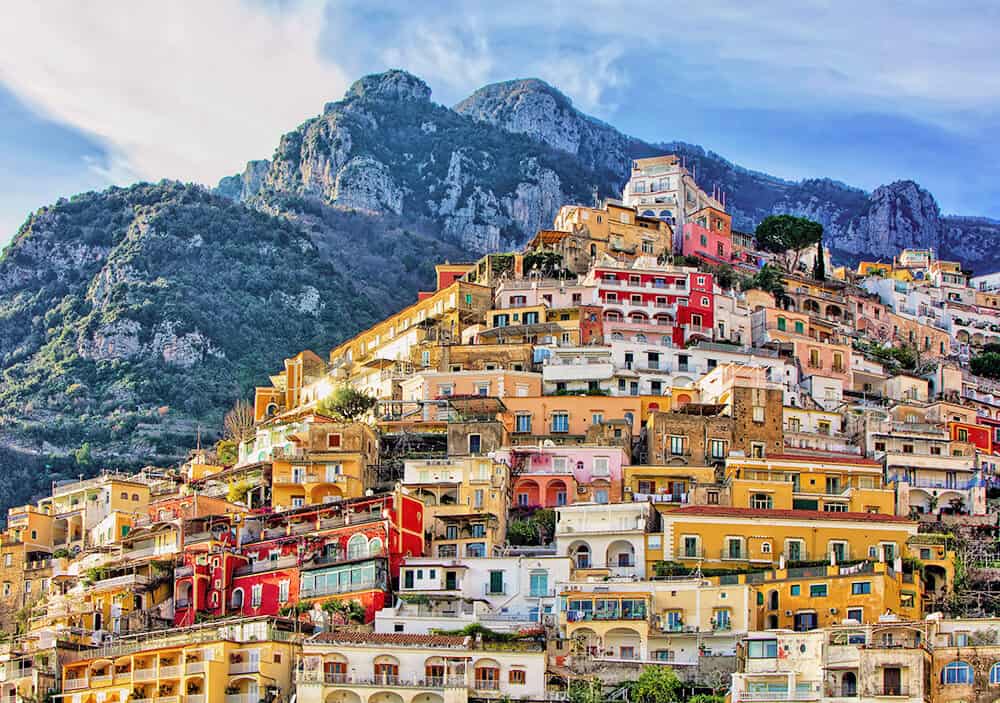 Amalfi Coast hotels - Positano pastel colored houses seen from Marina di Positano