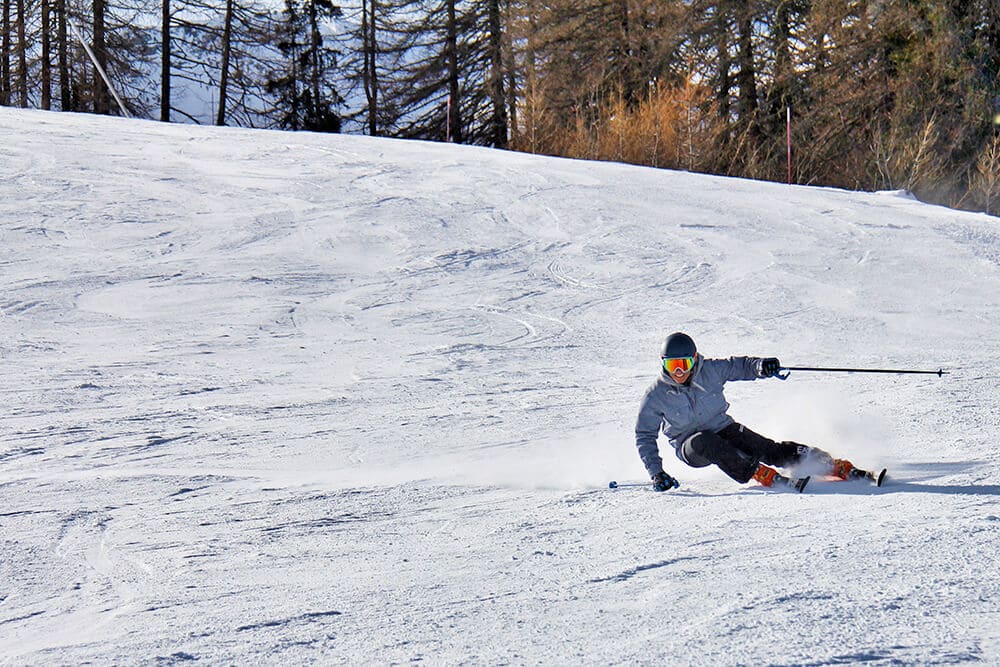 Woman skiing in the Dolomites on a trip to Italy in winter