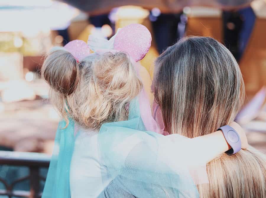 Disney World tips for first timers  | Mother hugging a child wearing Minnie Mous ears