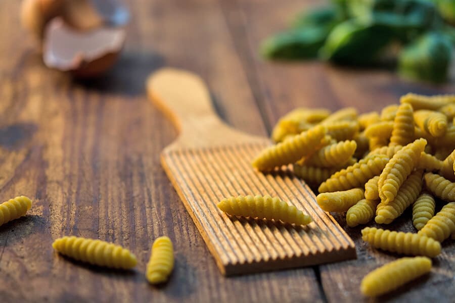 Handmade pasta - fresh gnocchi prepared on a cooking lesson in Italy