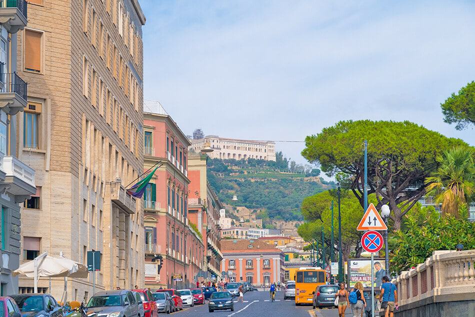 View of Certosa di San Martino on the top of a hill seen from Borgo Santa Lucia in Naples (Italy)