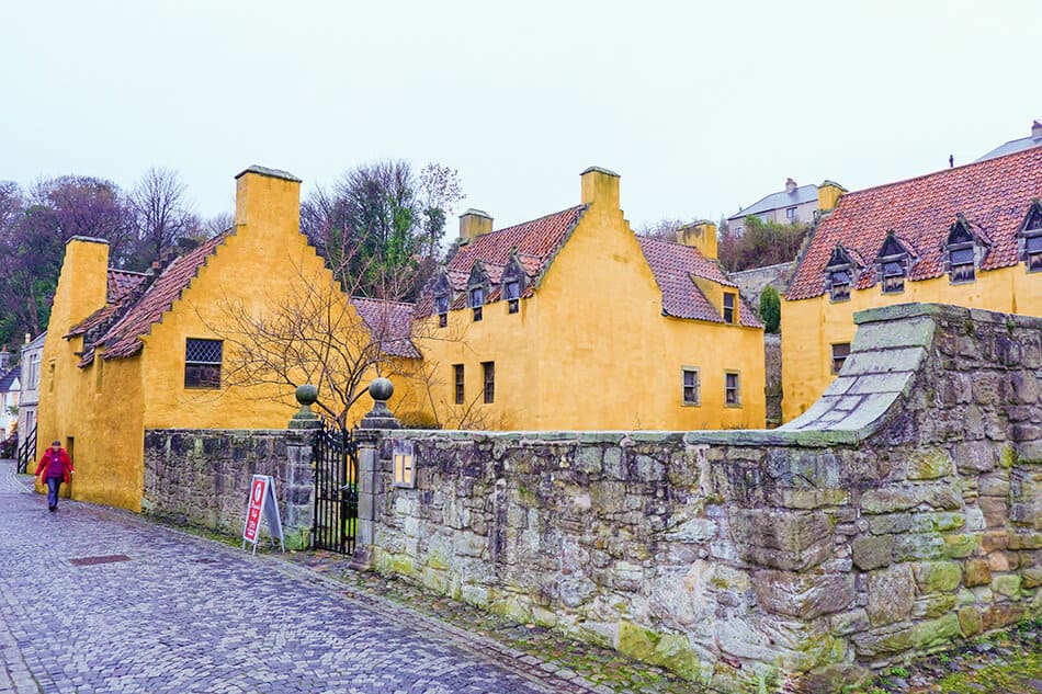 Yellow houses and a cobbled street at the historical village of Culross