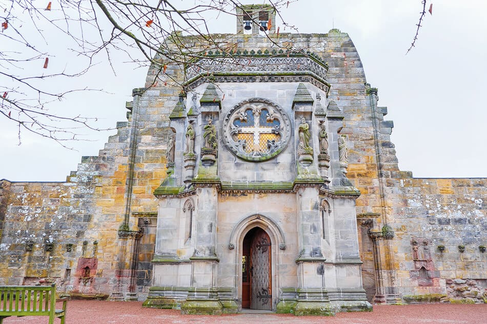 View of the main entrance to Rosslyn Chapel on a rainy day
