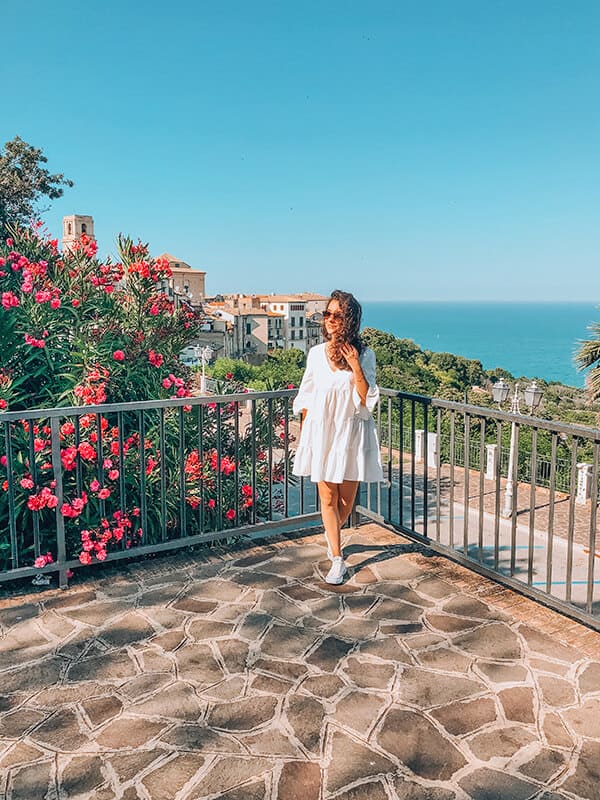 Woman in a white linen dress on the Amalfi Coast (Italy)
