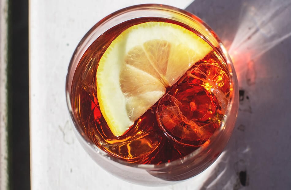 A glass of Irn Bru with a slice of lemon on the top