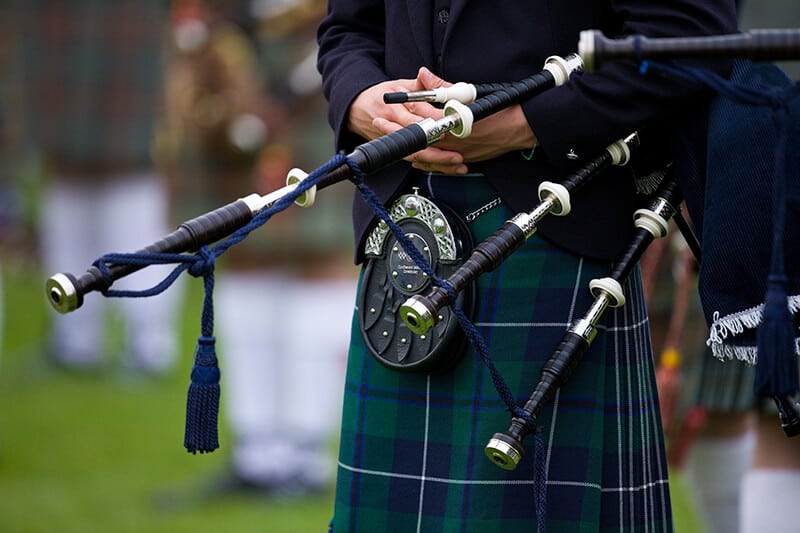 Traditional Scottish kilt with sporran and bagpipe