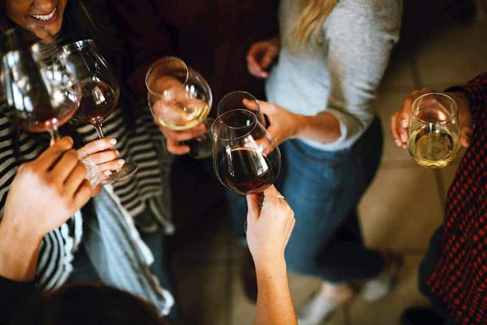 People toasting with wine glasses at one of the bars in Soho