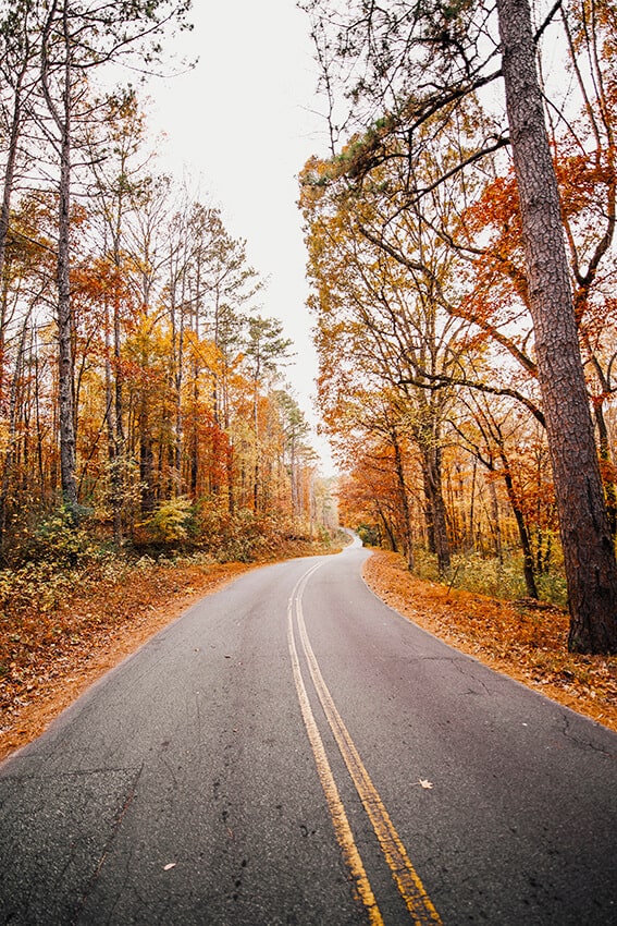 Road trip in autumn in the Adirondacks with red leaves 