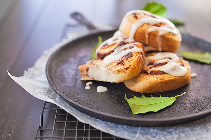 Cinnamon rolls piled up high on a plate