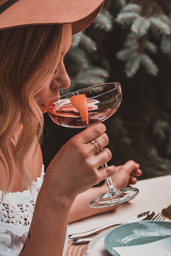 Woman sipping a fancy cocktail at Sugar, Miami